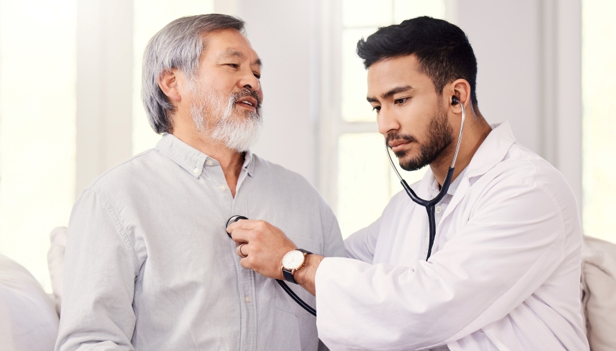 Physician listening to a heart with stethescope