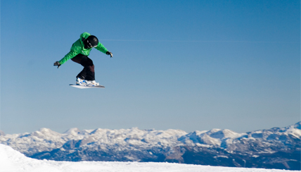 snowboarder hitting a jump