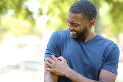 Man scratching his arm