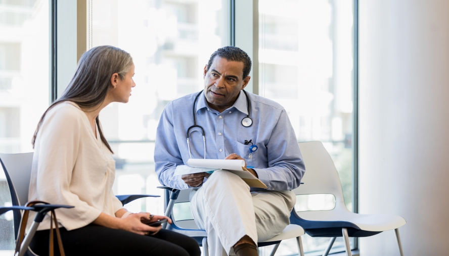 Patient speaking with her doctor.