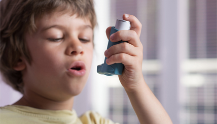 young child using an inhaler