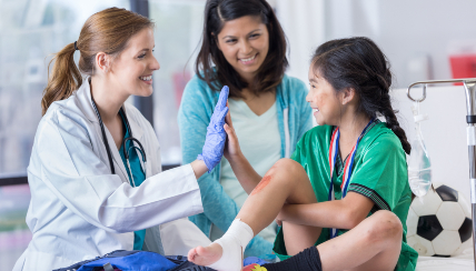 Doctor gives young patient a high five