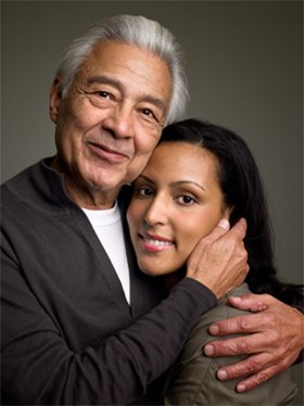 Man and woman sharing an embrace and smile