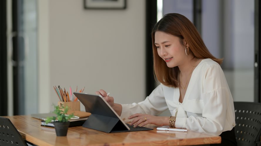 Woman with tablet and stylus