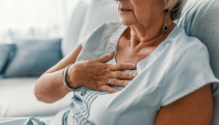 COVID-19 & Sarcoidosis: Woman holding chest